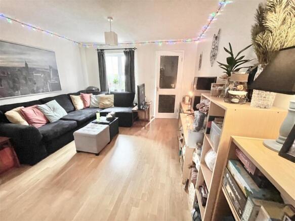 Bright, contemporary living room with a large L...