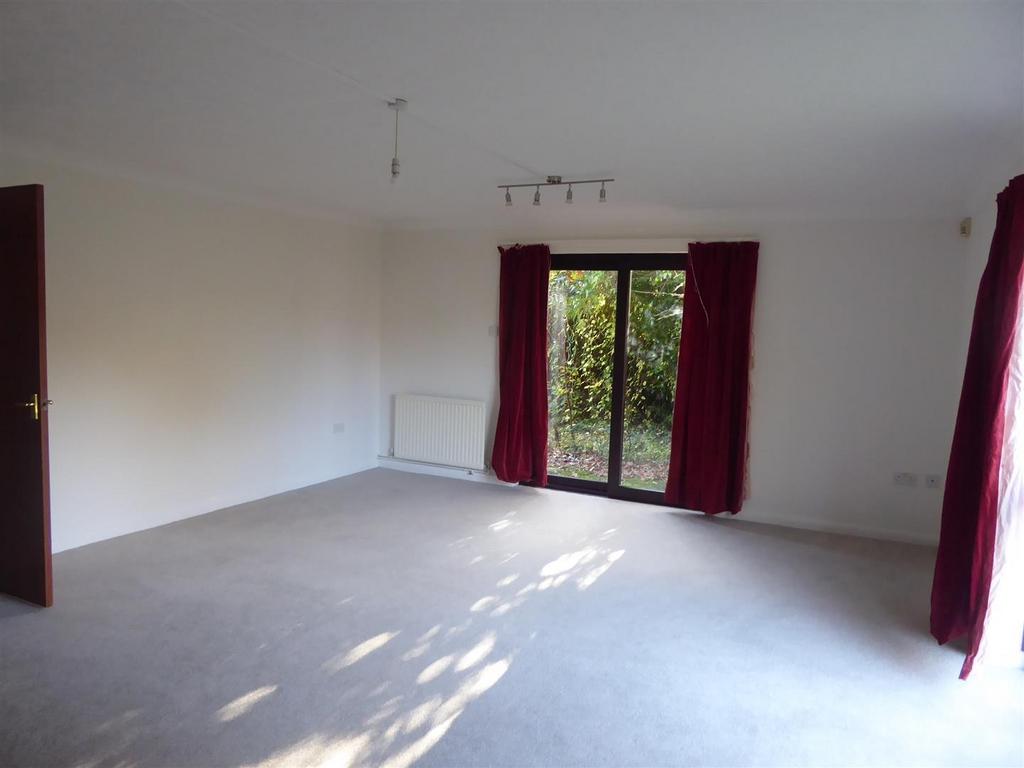 Expansive bright living area with garden access...