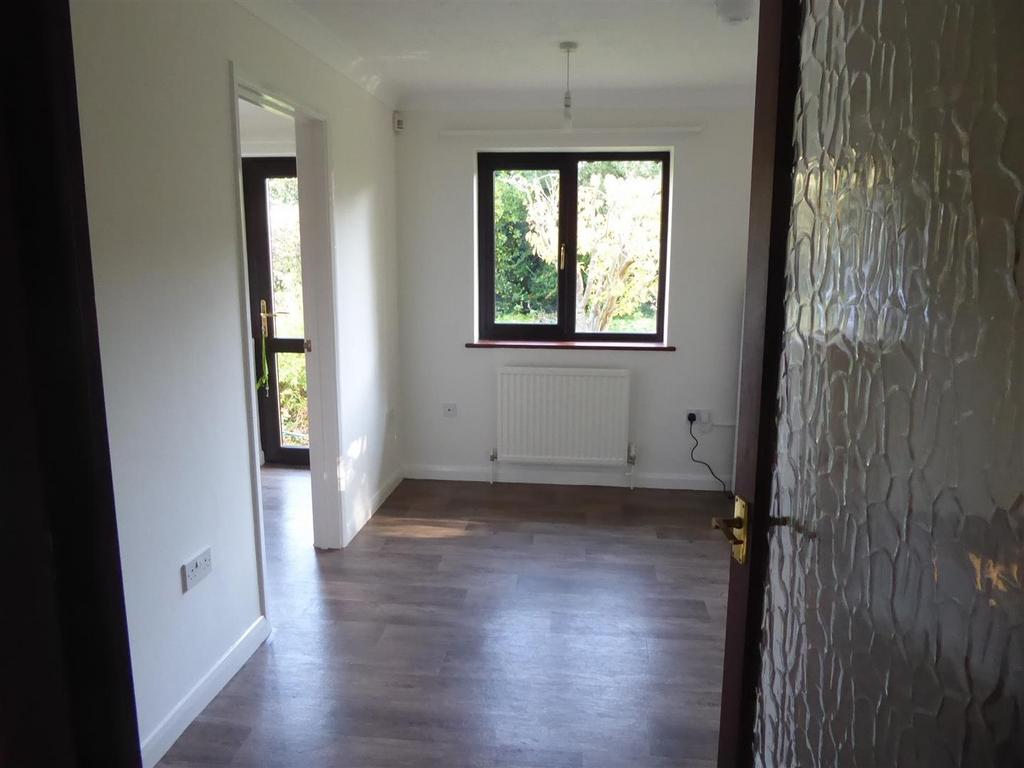 Bright and airy room with modern wood flooring...