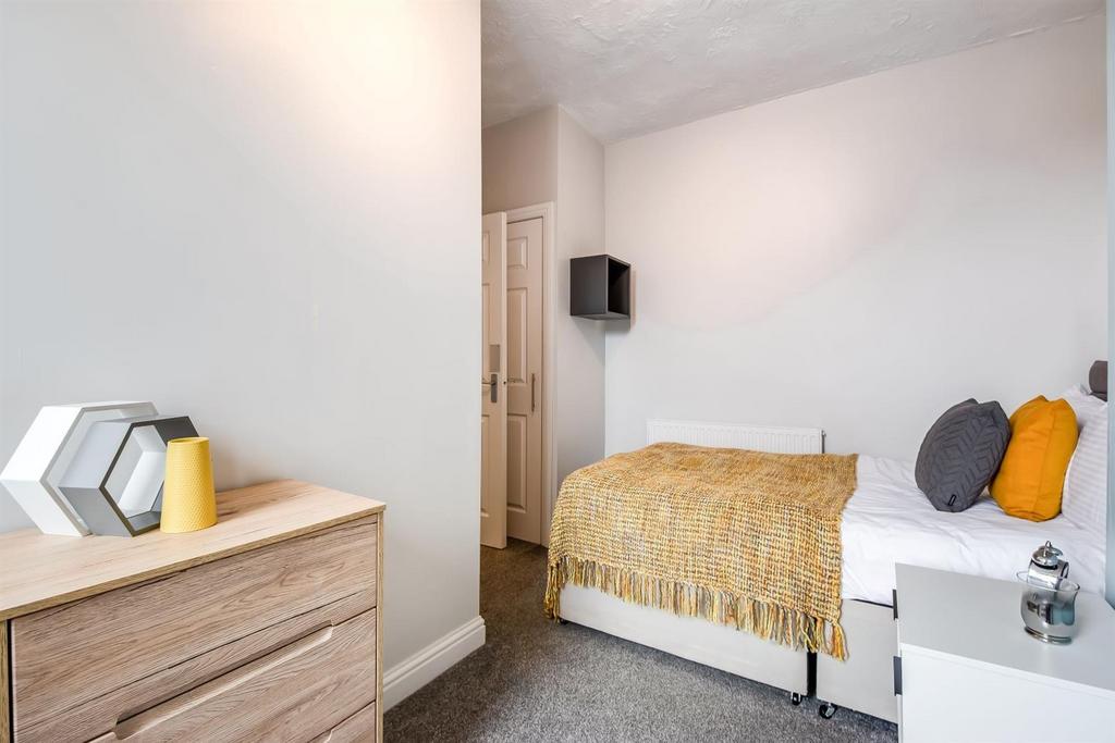 Neat single bedroom with a comfortable bed, bed...