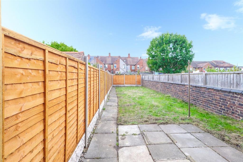 Spacious sunny garden with lawn and patio area...