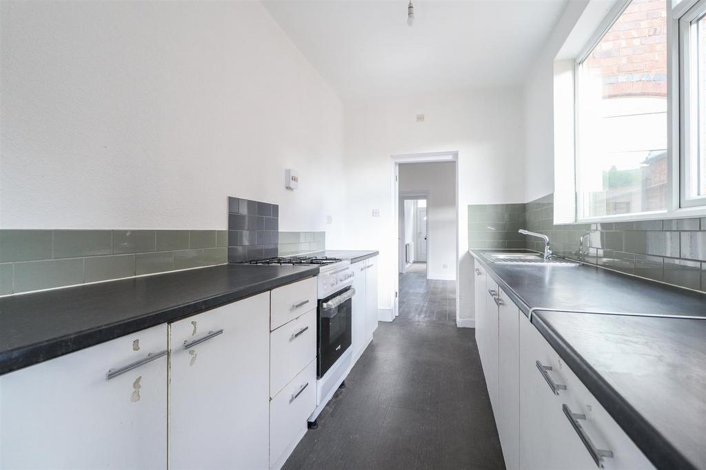 Bright modern kitchen with sleek white cabinets...