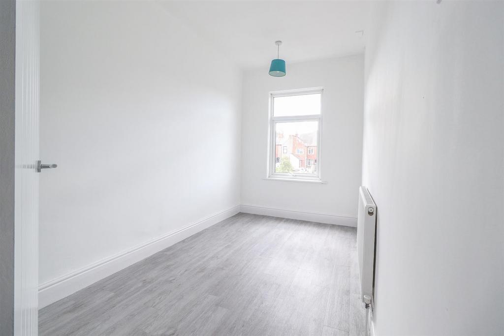 Bright and airy room with modern wood flooring...