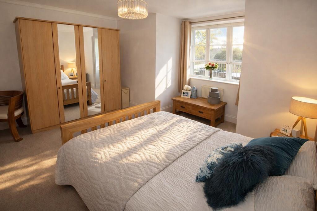 Sunlit bedroom with oak furniture