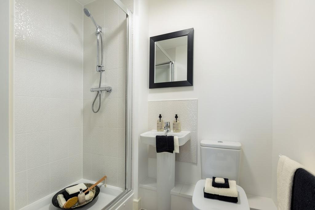 A thoughtfully designed en suite bathroom that...