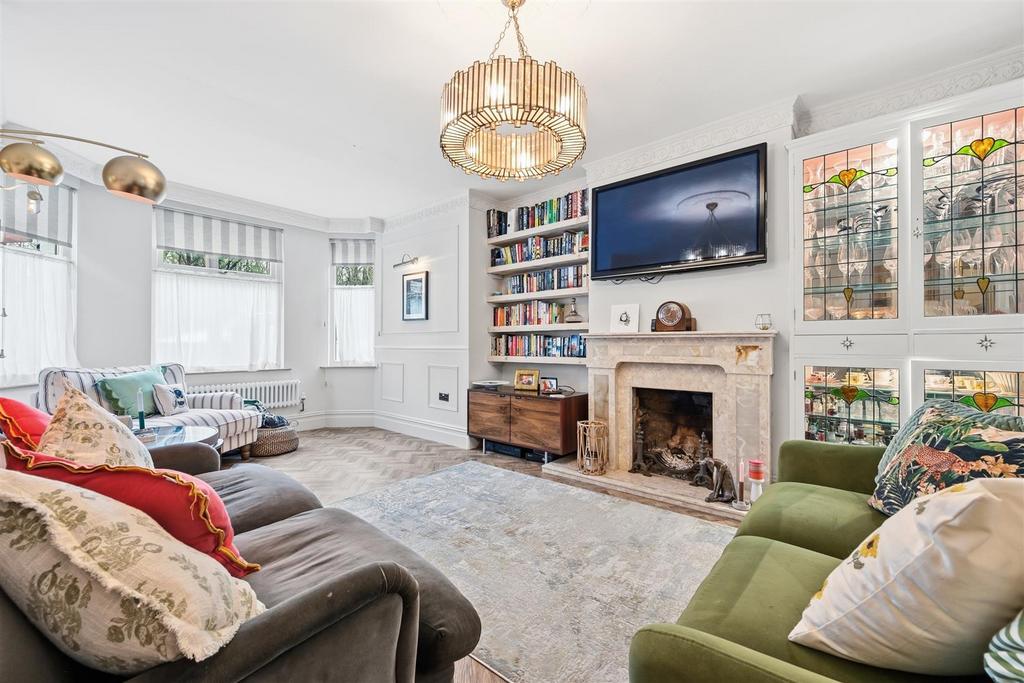 Sitting Room to fireplace and windows.jpg