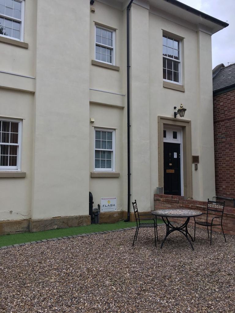 Charming pale-cream front with classic sash win...