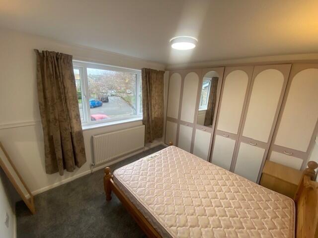 Bright bedroom with fitted wardrobes and double...