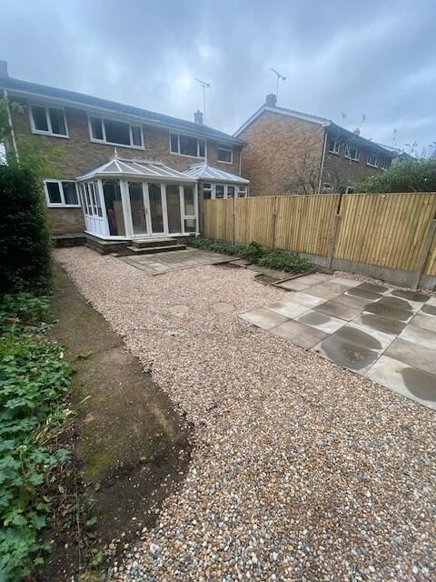 Low-maintenance rear garden with patio and grav...