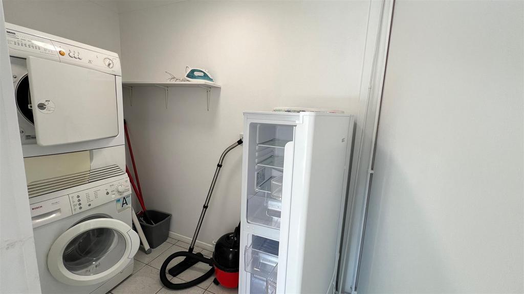 Functional utility room with washer, dryer and ...