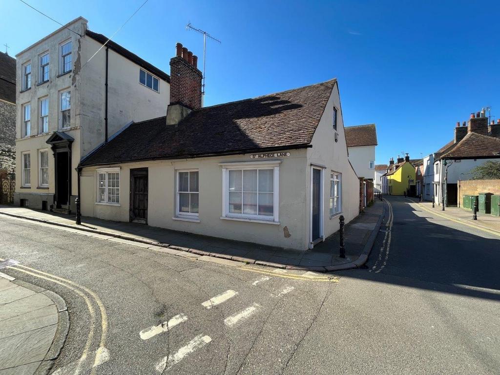 Corner cottage with bright exterior and streets...