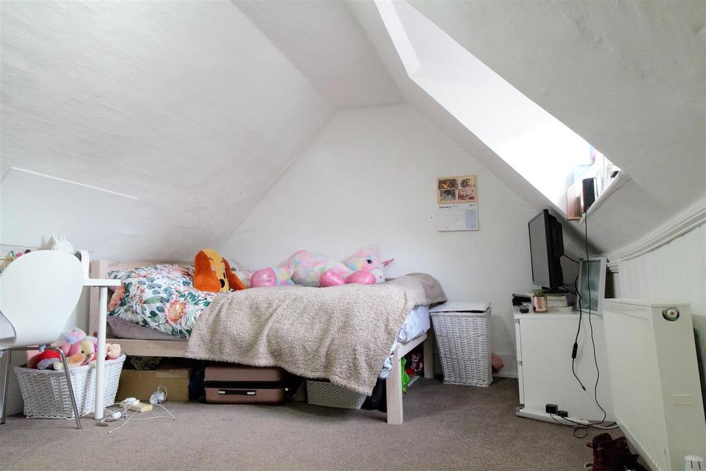 Bright attic double bedroom with sloped ceiling...