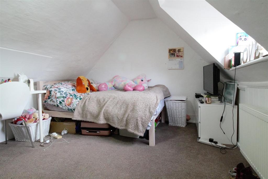 Bright attic double bedroom with sloped ceiling...