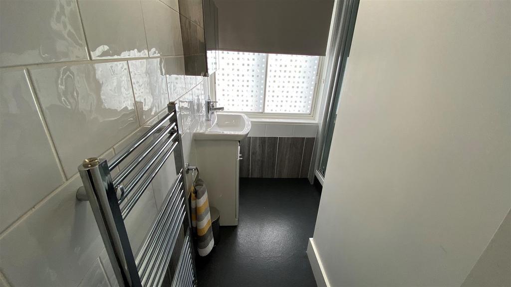 Bright modern bathroom with heated towel rail...