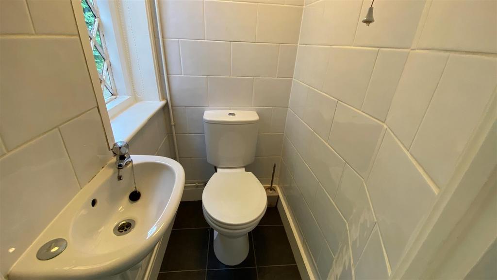 Compact WC with clean fittings and window light...