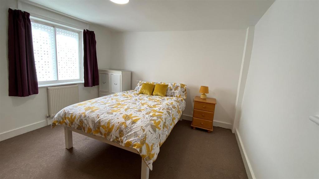 Bright room with double bed and storage...