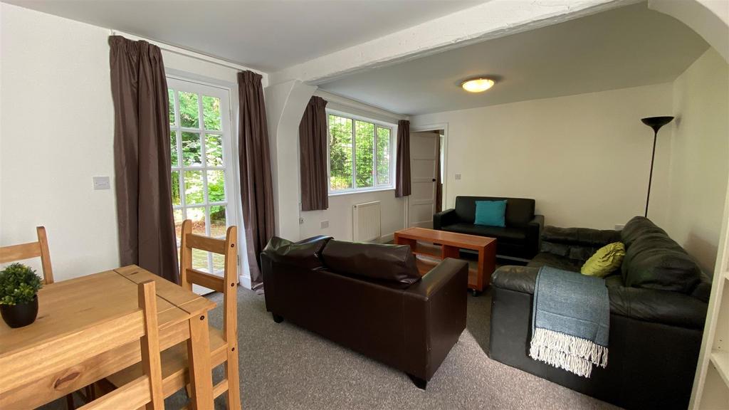 Bright lounge with sofas and dining area...