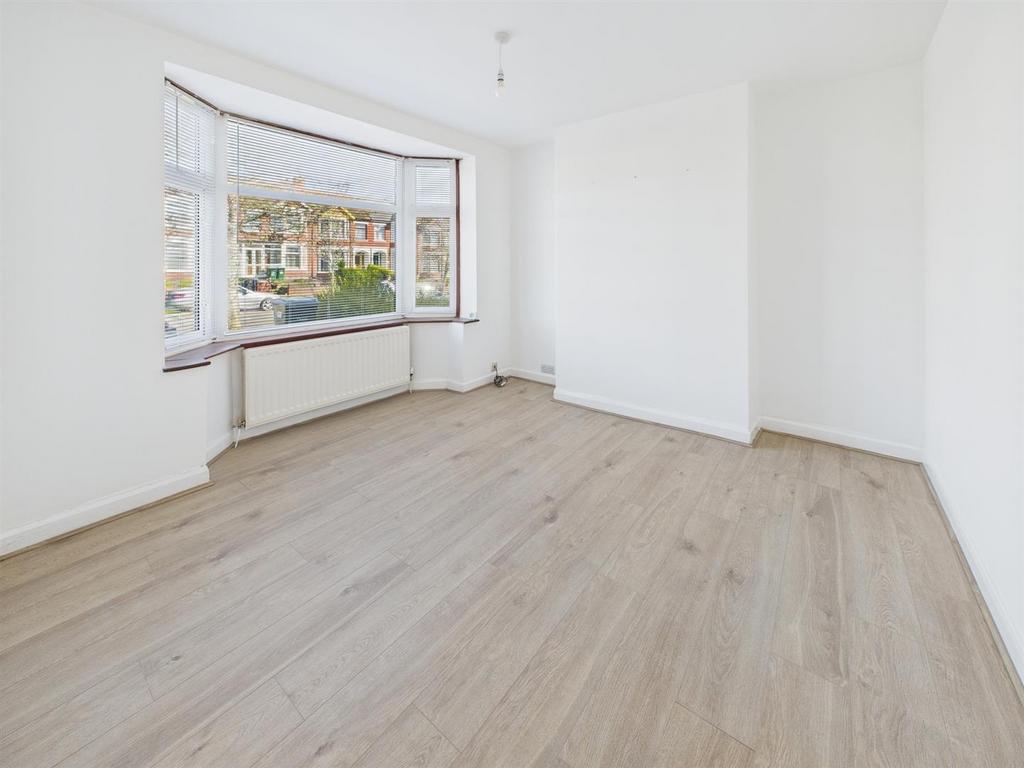 Bright spacious room with stylish wood flooring...