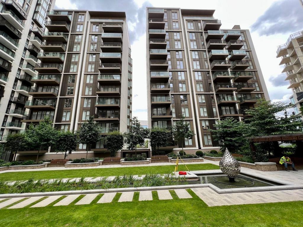 Well-kept communal courtyard with water feature...