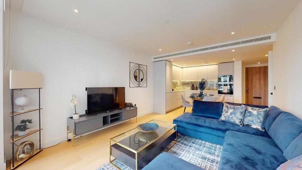 Bright modern open-plan living area with blue s...