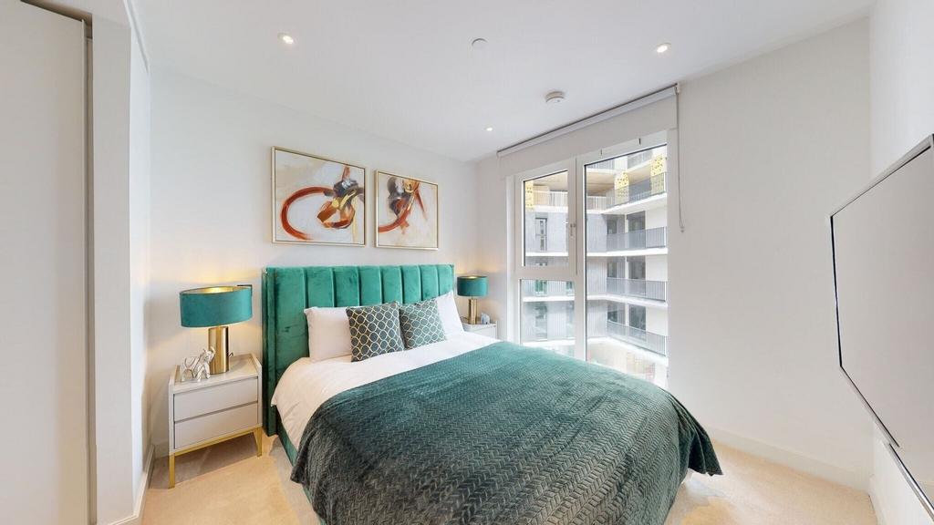 Bright bedroom with stylish teal bed and views...