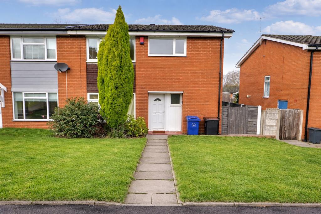 Neat semi with tidy lawn and paved path...