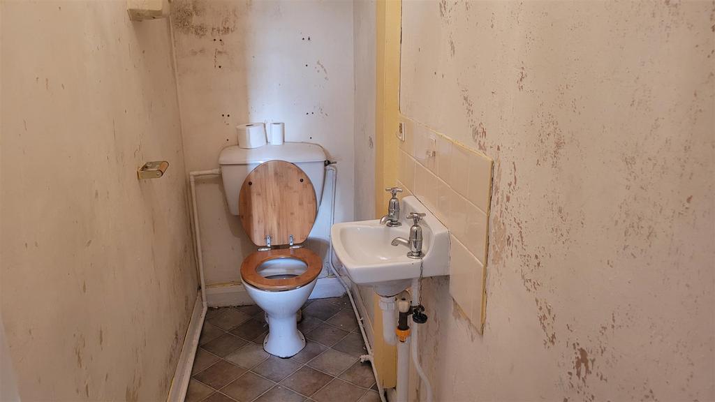 Ground floor Toilet and hand washbasin understairs