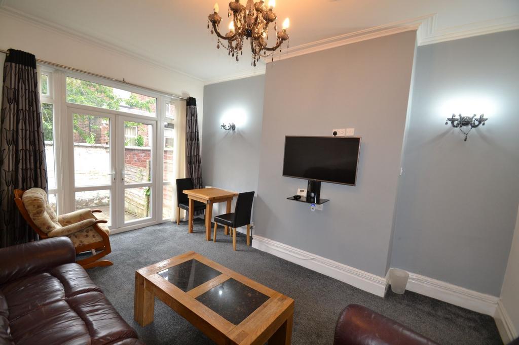 Bright and inviting living room featuring large...