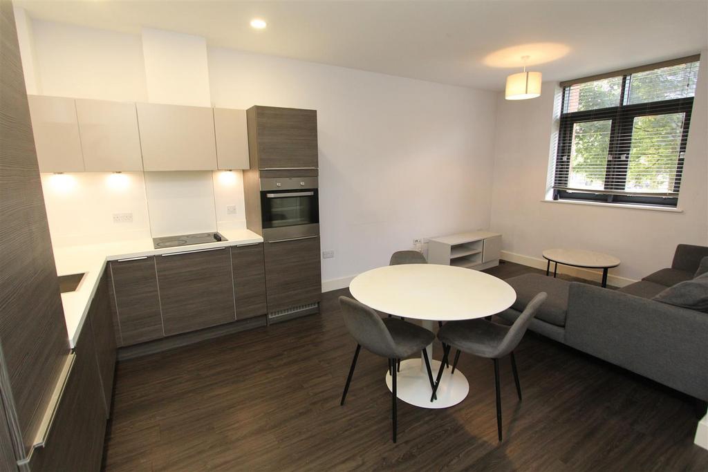 Modern open-plan kitchen with sleek dining area...