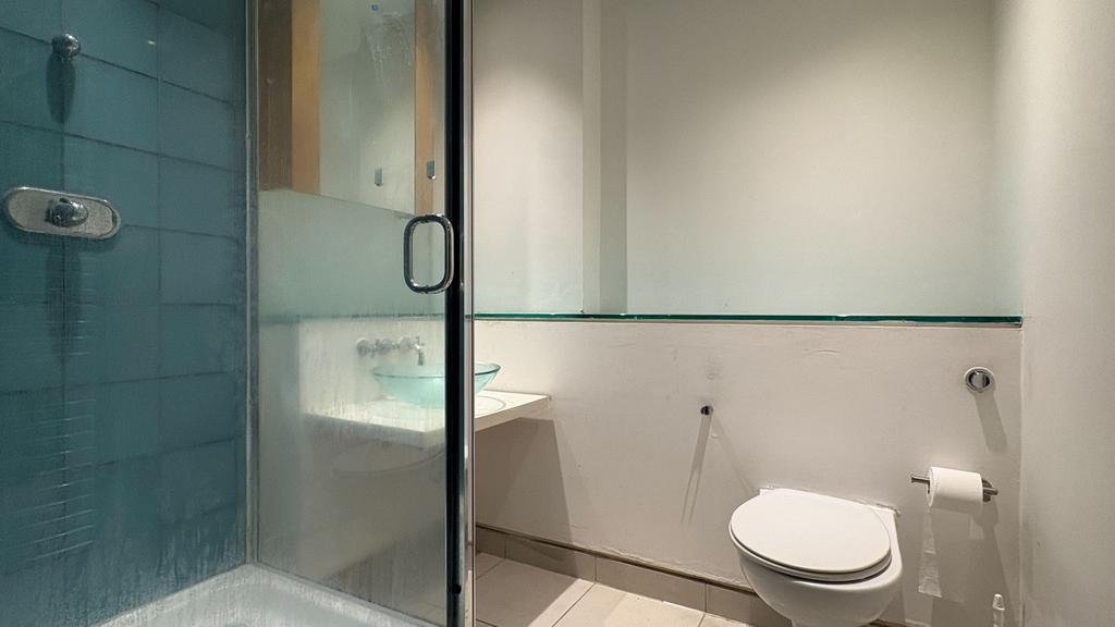Modern bathroom with sleek glass walk-in shower...
