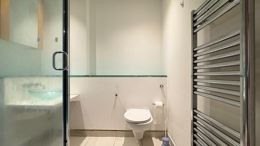 Modern bathroom with sleek heated towel rail...