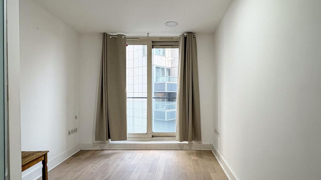 Bright modern room with sleek wood floors...