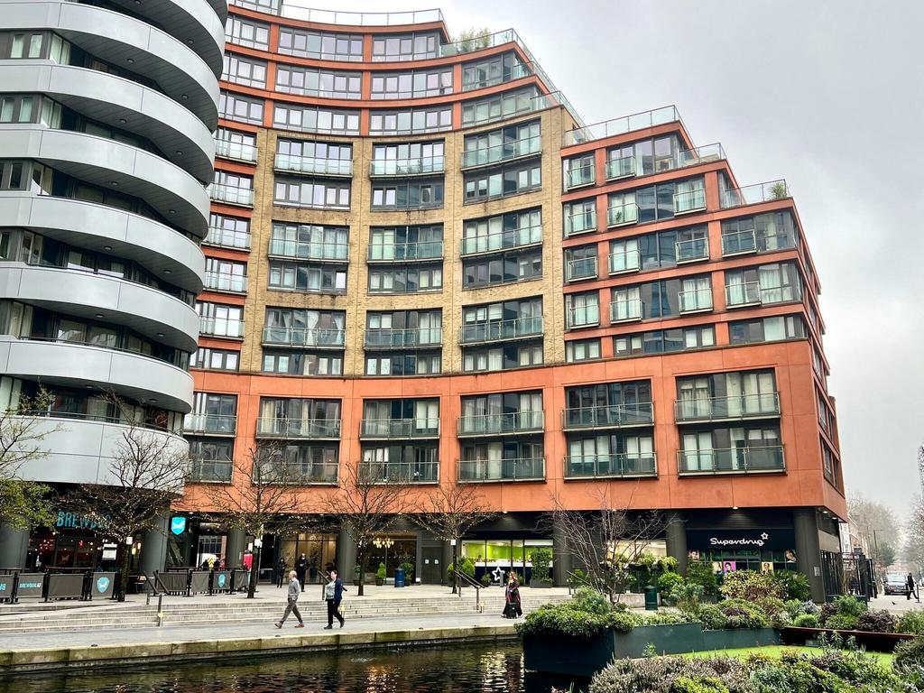 Modern apartment complex by scenic waterfront...