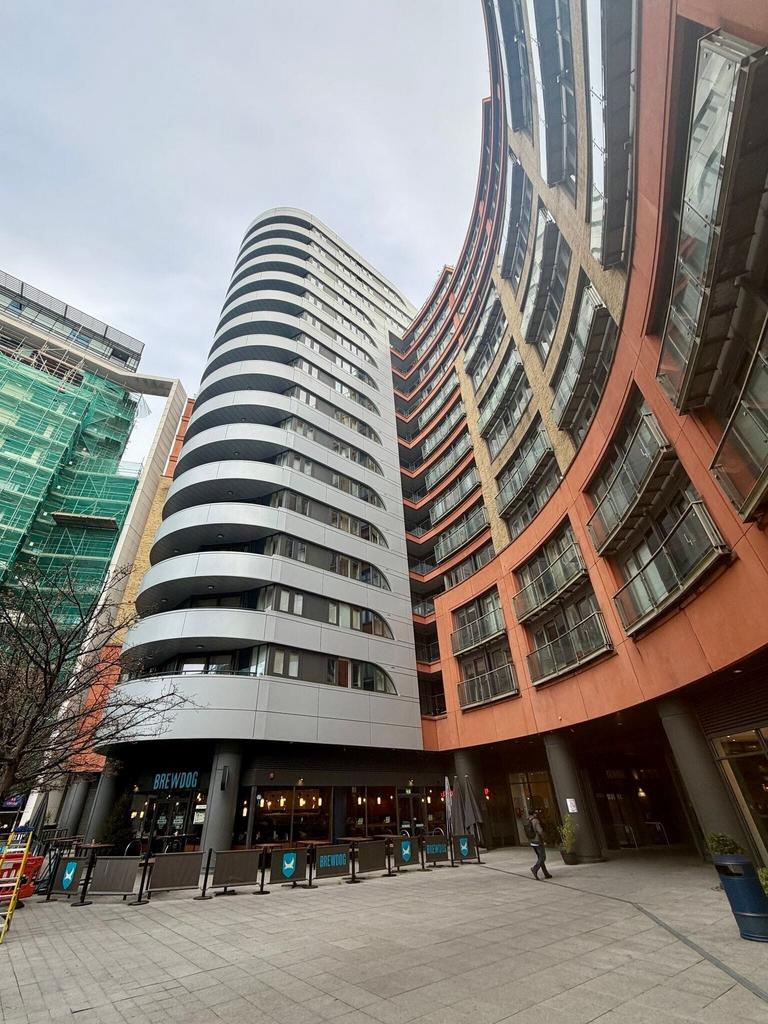 Modern urban plaza with striking architecture...