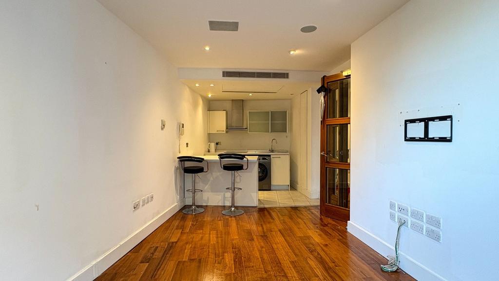 Bright open living area with modern breakfast b...