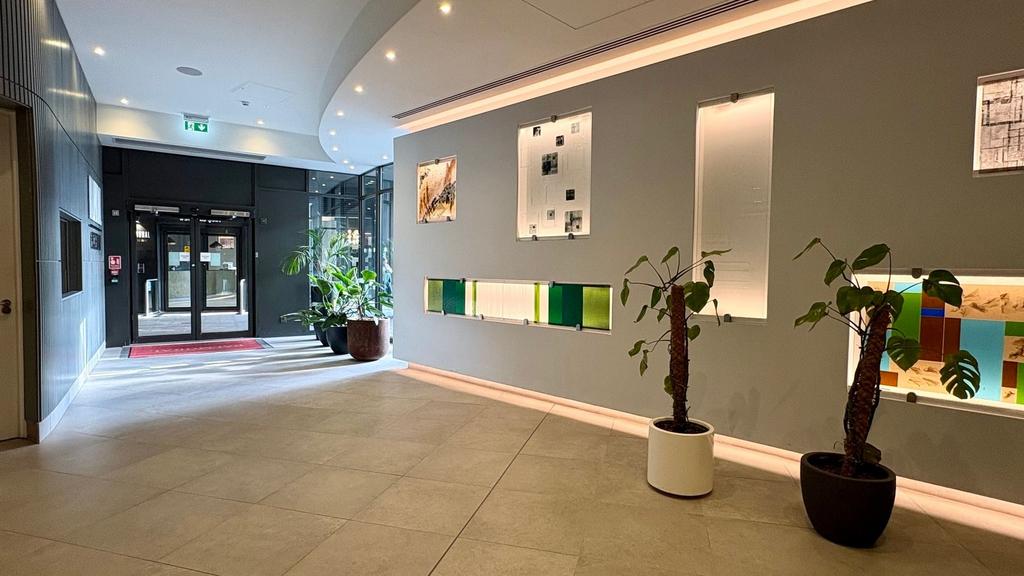Modern lobby with stylish art and lush plants...
