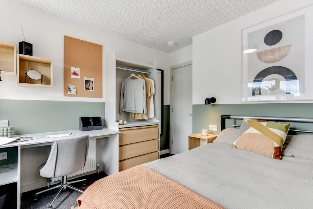 Bright, modern bedroom with a comfortable doubl...