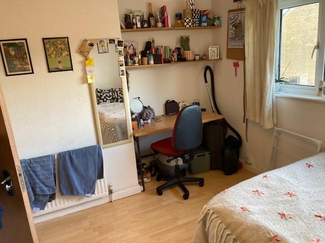 Cozy furnished bedroom with a comfortable bed, ...
