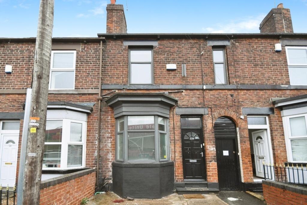 Brick-fronted terraced house with bay window an...