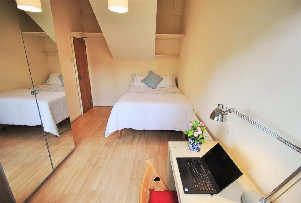 Bright double bedroom with study desk and mirro...