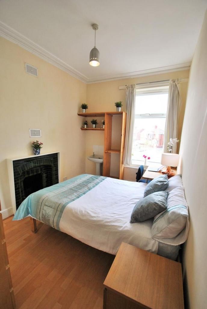 Bright bedroom with double bed and desk space...