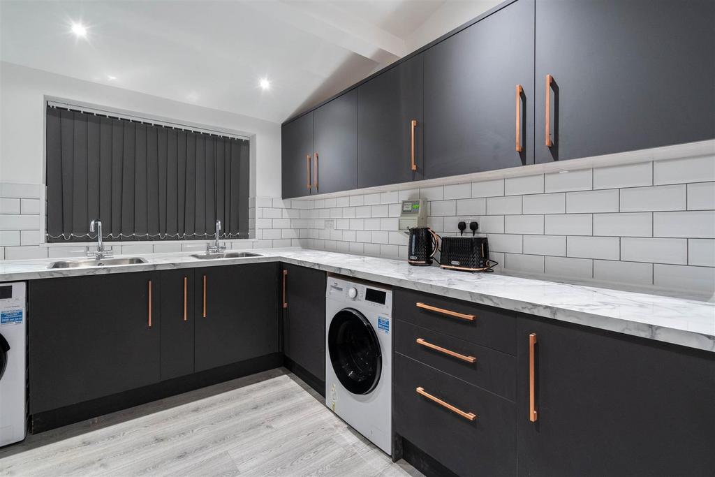 Modern kitchen with sleek dark cabinets...