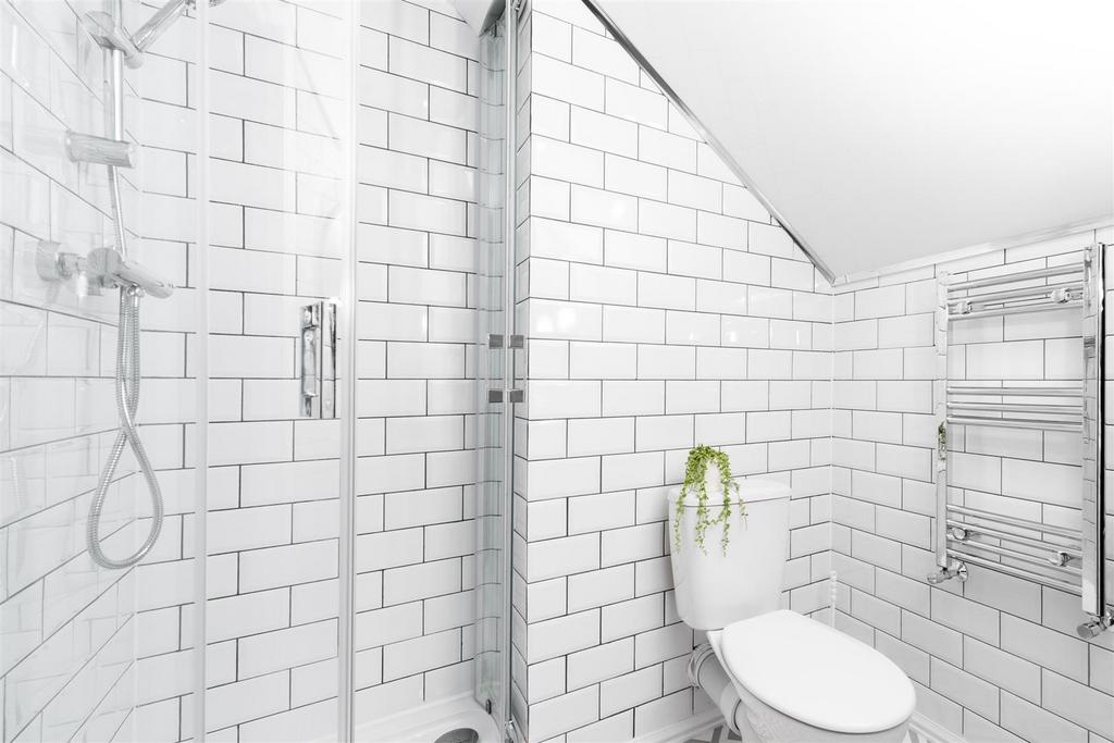 Bright modern bathroom with chic subway tiling...