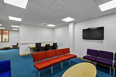 Bright workspace with ample seating and tech....