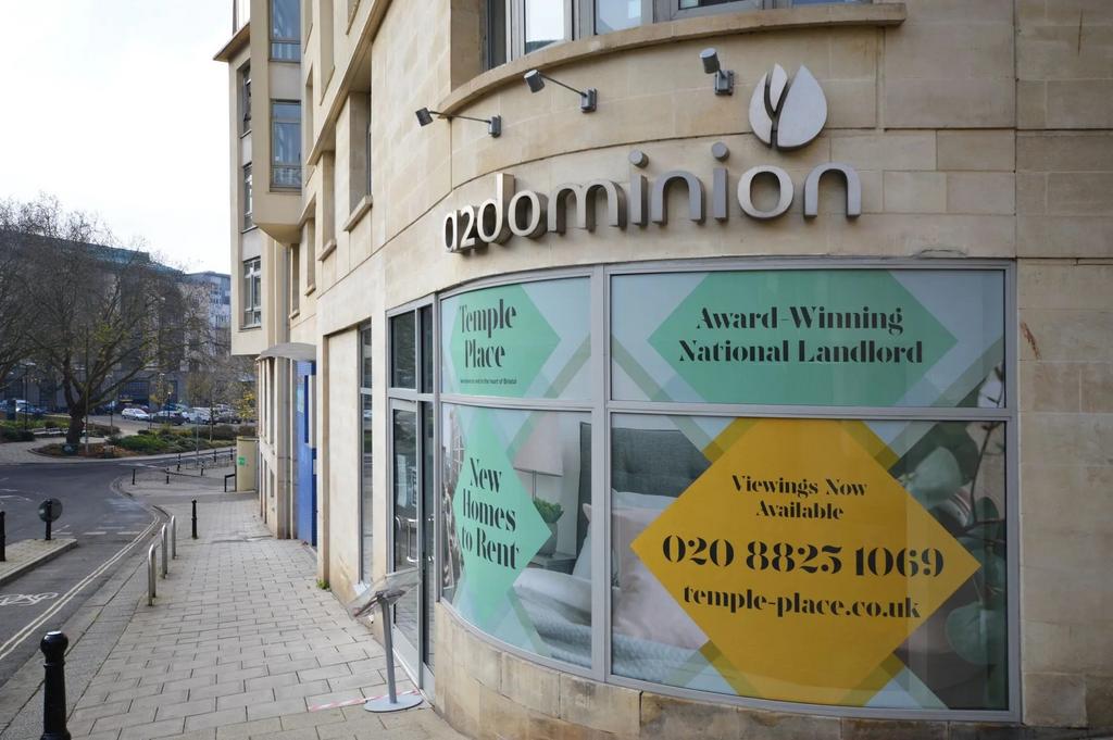 Modern urban building with clear signage...