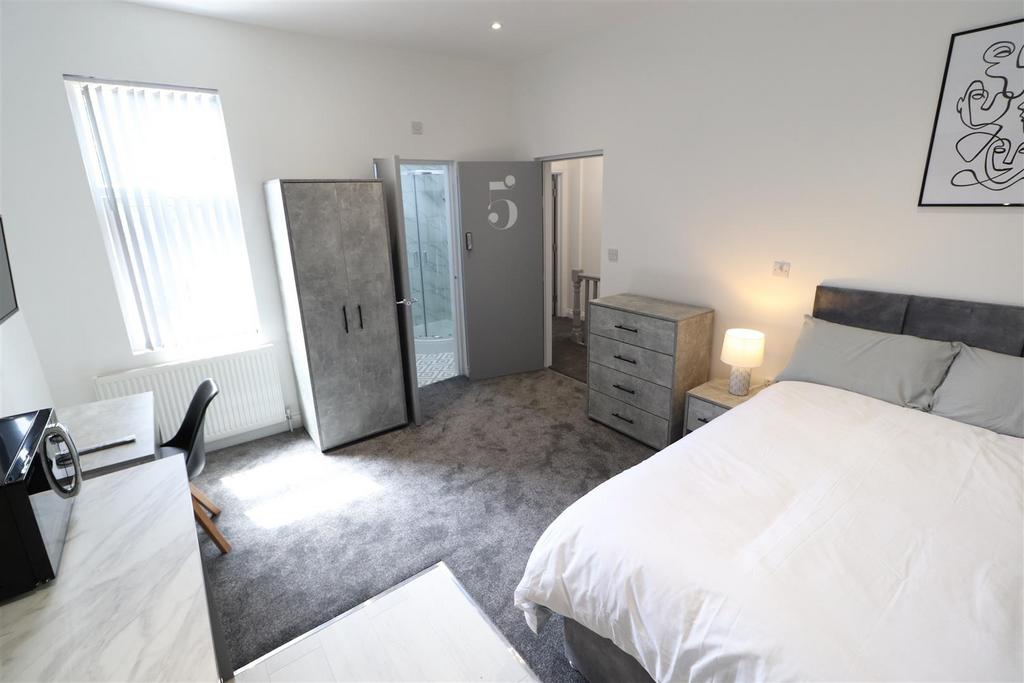 Bright, modern bedroom with ample storage space...