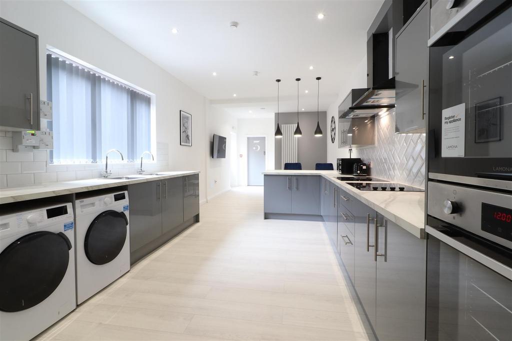 Modern gloss kitchen with laundry facilities...