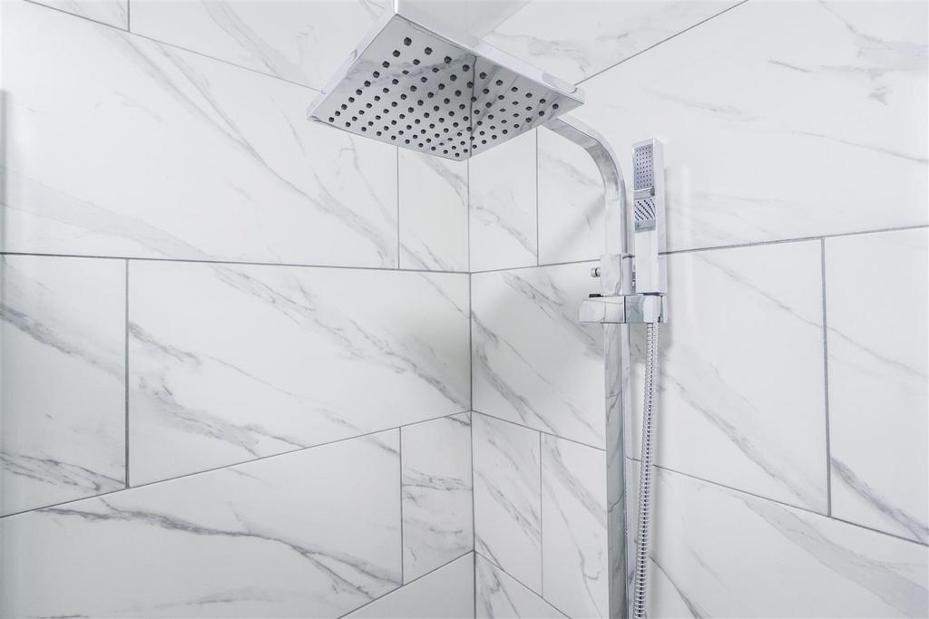Modern rainfall shower with marble effect tilin...