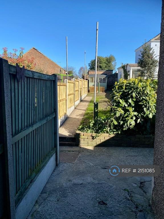 Garden With Side Gate To Pathway