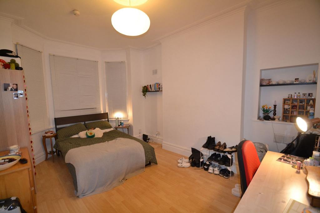 A cozy and welcoming living room featuring a do...